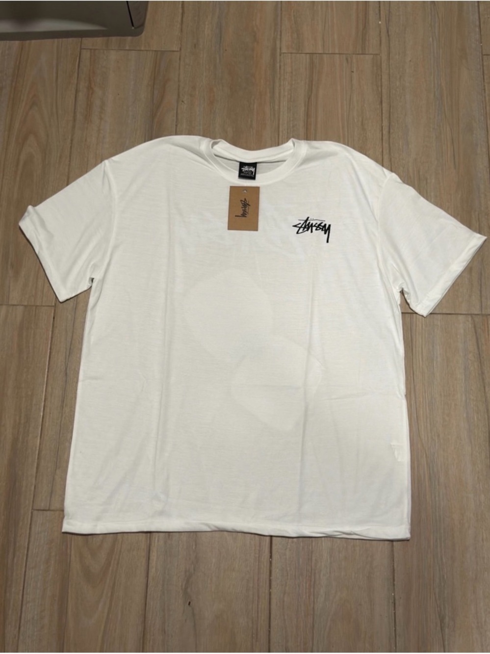 Stussy White T-Shirt with Black Logo Chest Print